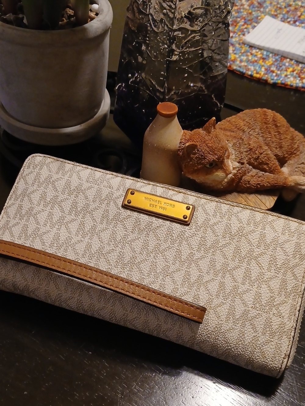 Michael Kors Cream Monogram Wristlet with Brown Strap